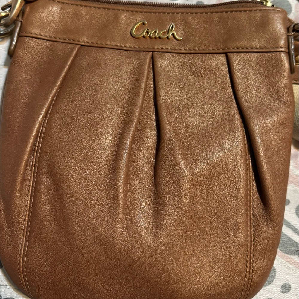 Brown coach x body with adjustable strap.